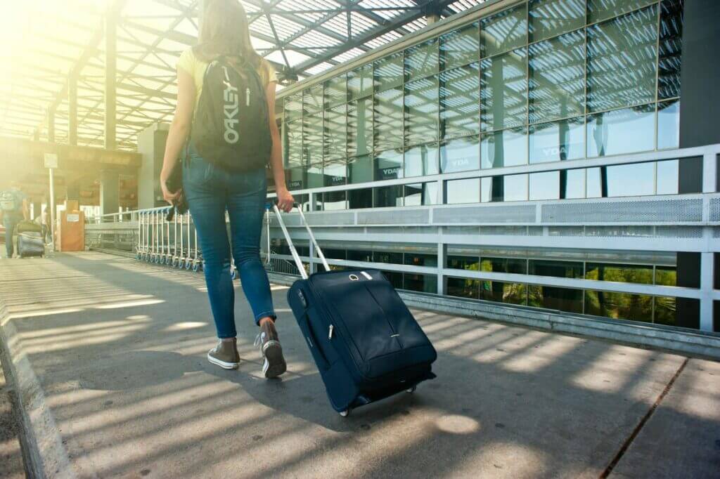 Woman with suitcase at airport